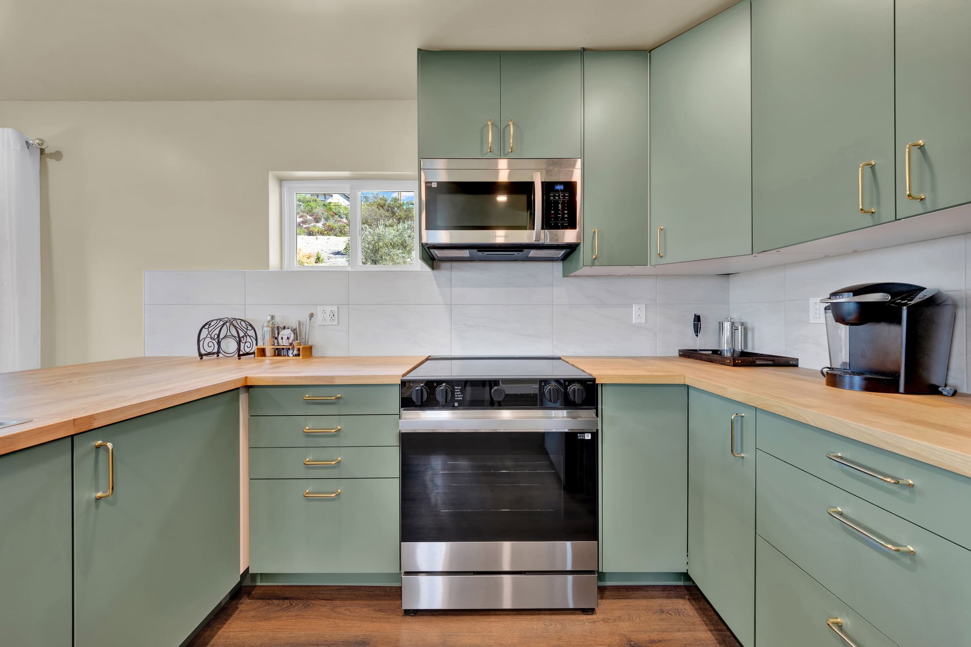 The range wall. Cabinets run to the ceiling on both sides, so there's no dead space collecting dust up top.