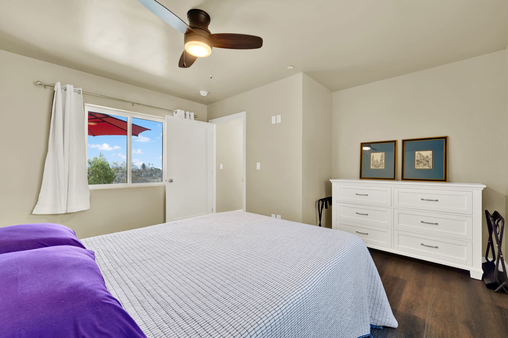 And from the opposite corner, with space for a full dresser alongside the bed.