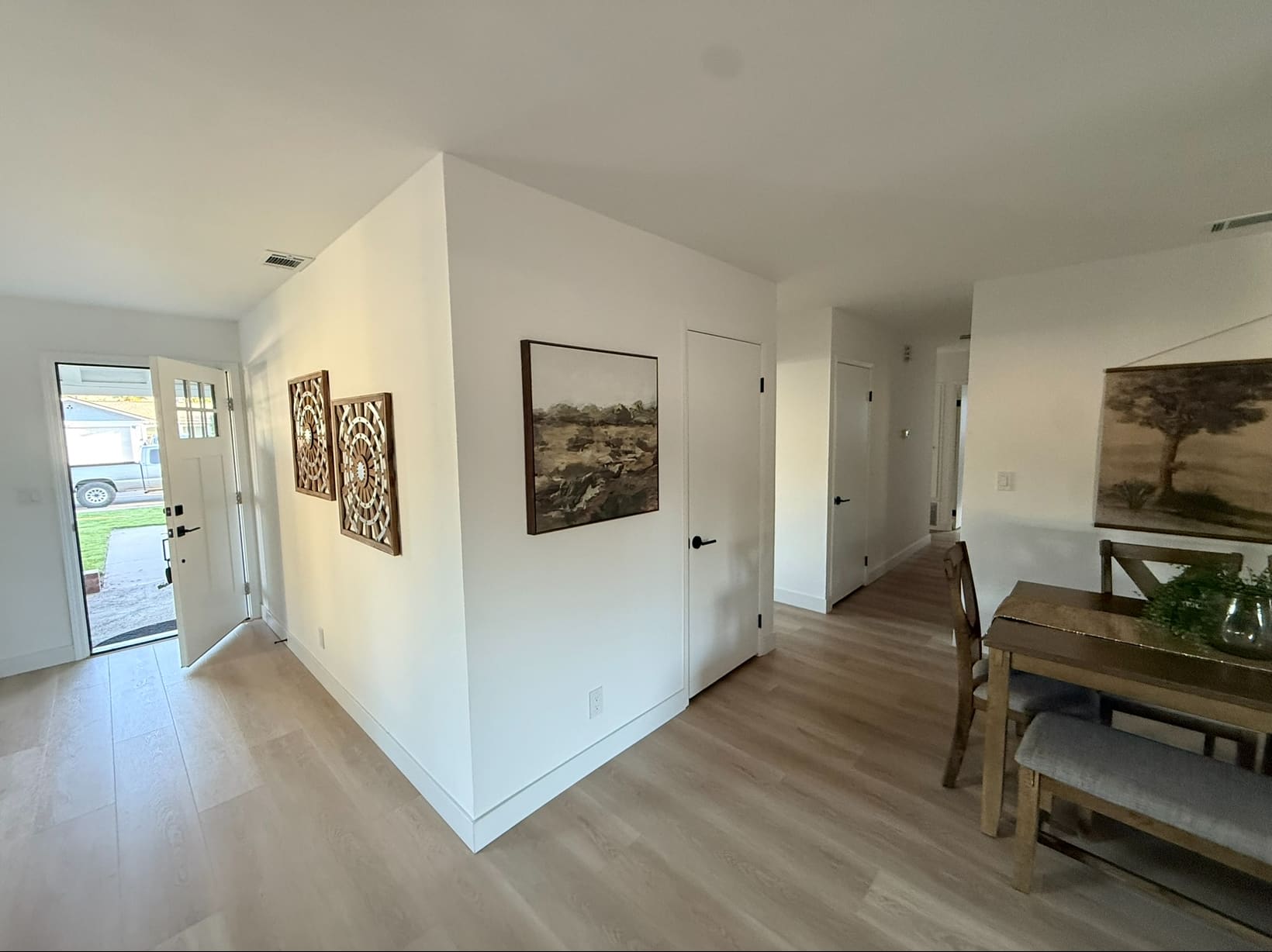 The entry. New flat-panel doors and matte black hardware went in throughout the house.