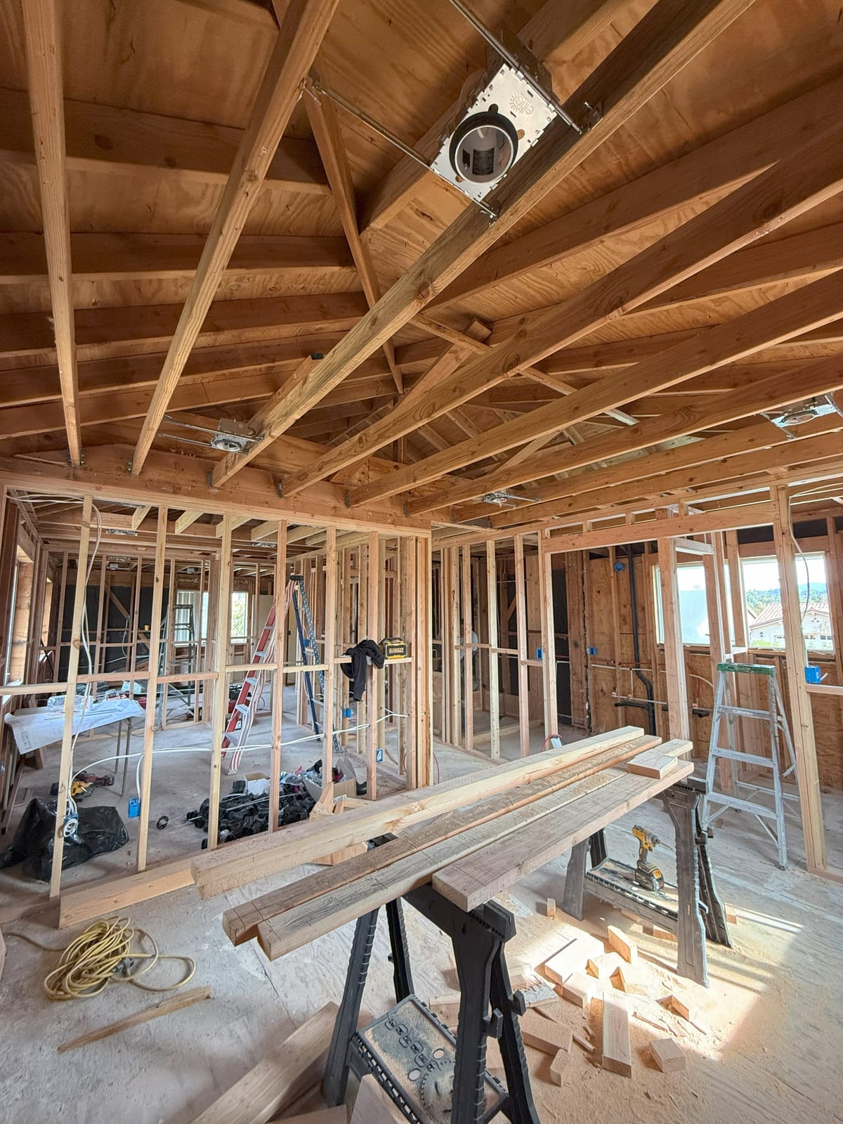 Mid-build, with lumber and layout in progress. One crew ran the whole job start to finish.