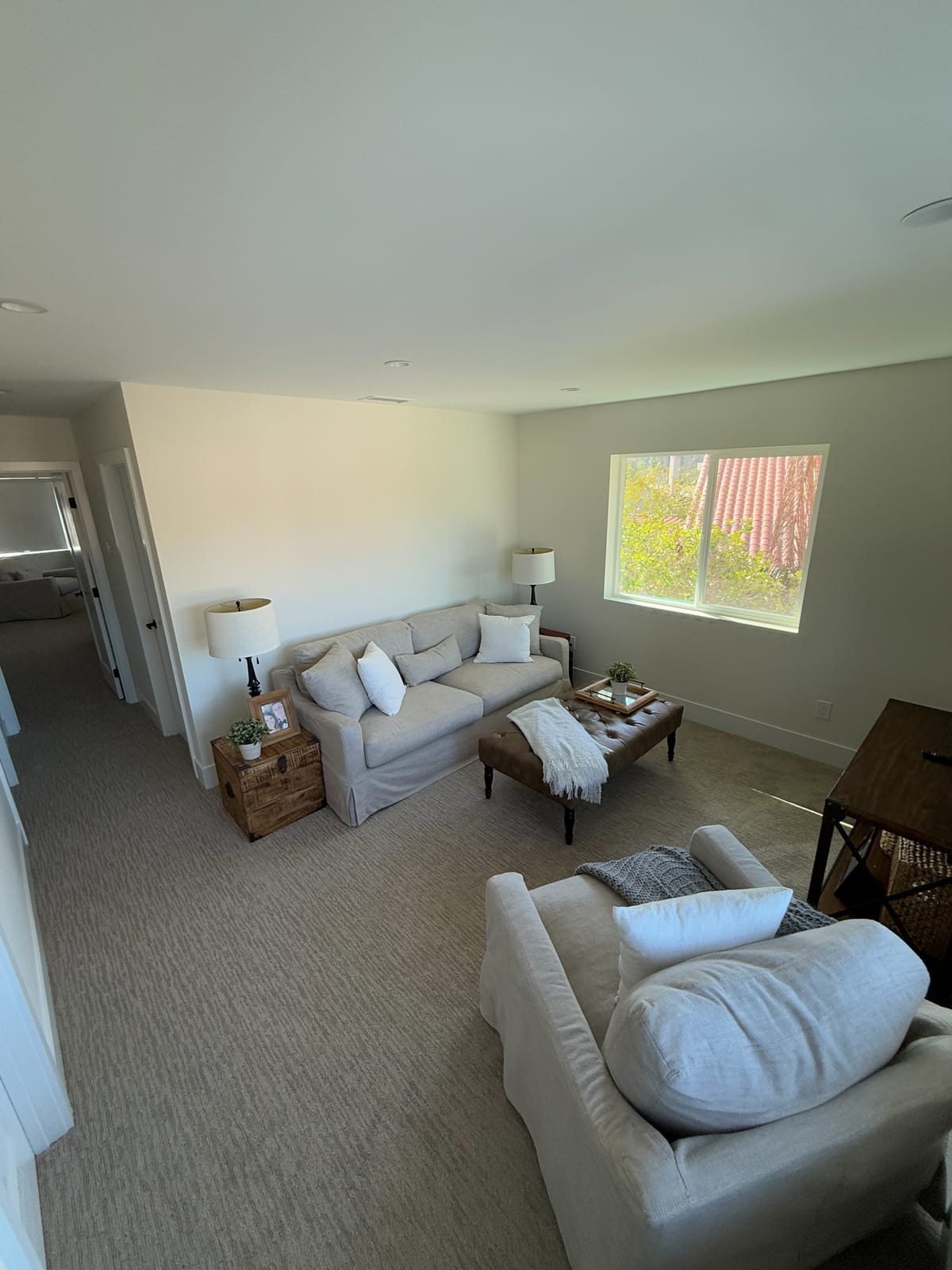 A sitting area off the main level. New carpet and paint keep it simple so the room feels open.